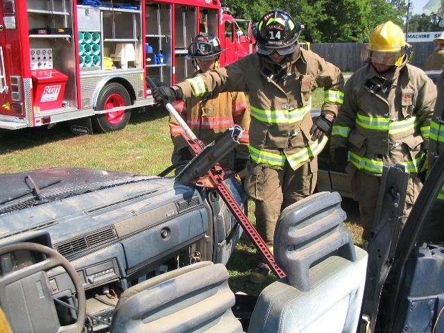 Firefighters Assessing the Vehicle