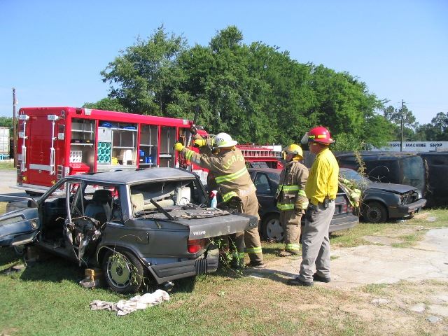 Firefighters Training on a Damaged Vehicle