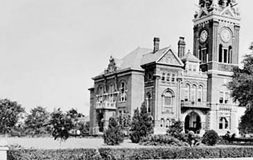 Antique photo of multi-story stone building